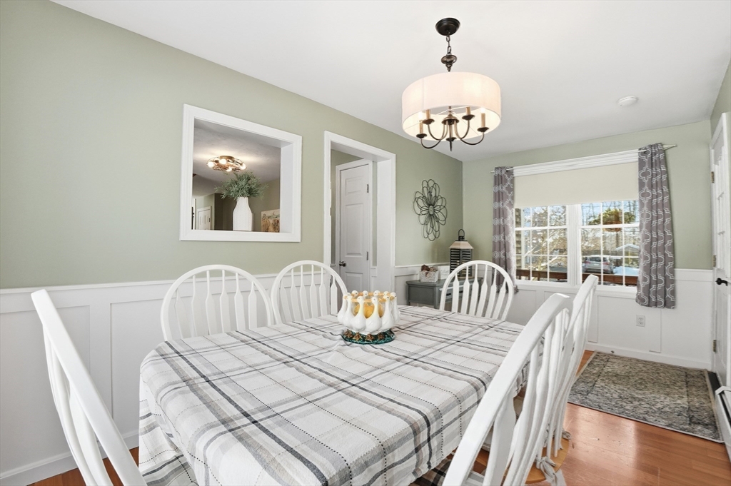 174 Columbus Drive Fall River, MA 02720 - Photo 15 of 33 a bedroom with a bed a chandelier and couch