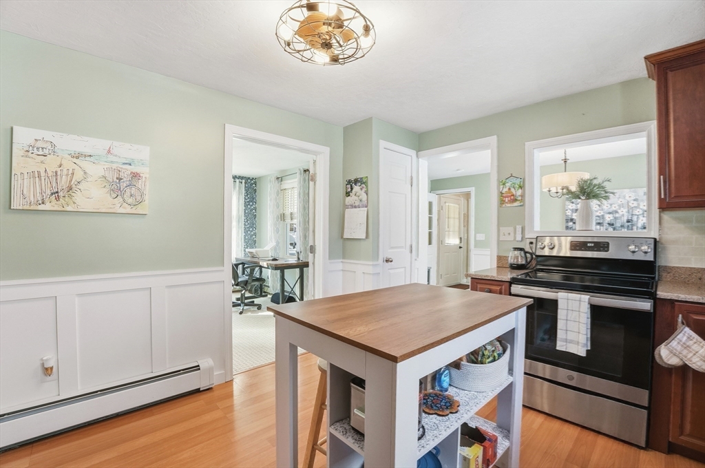174 Columbus Drive Fall River, MA 02720 - Photo 16 of 33 a kitchen with a stove cabinets and wooden floor