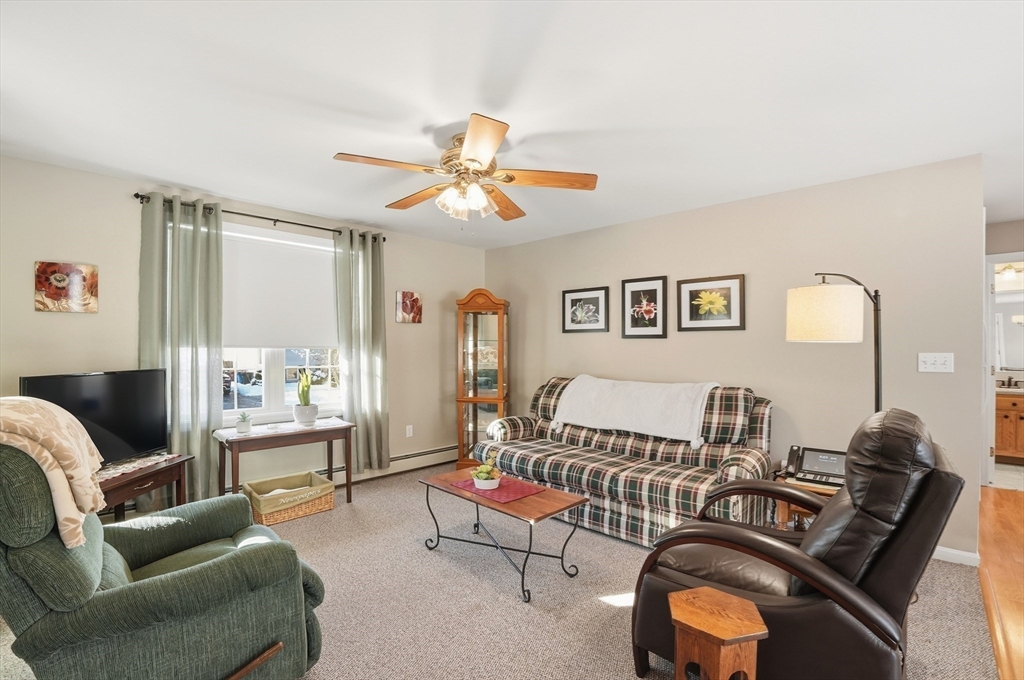 174 Columbus Drive Fall River, MA 02720 - Photo 5 of 33 a living room with furniture and a flat screen tv