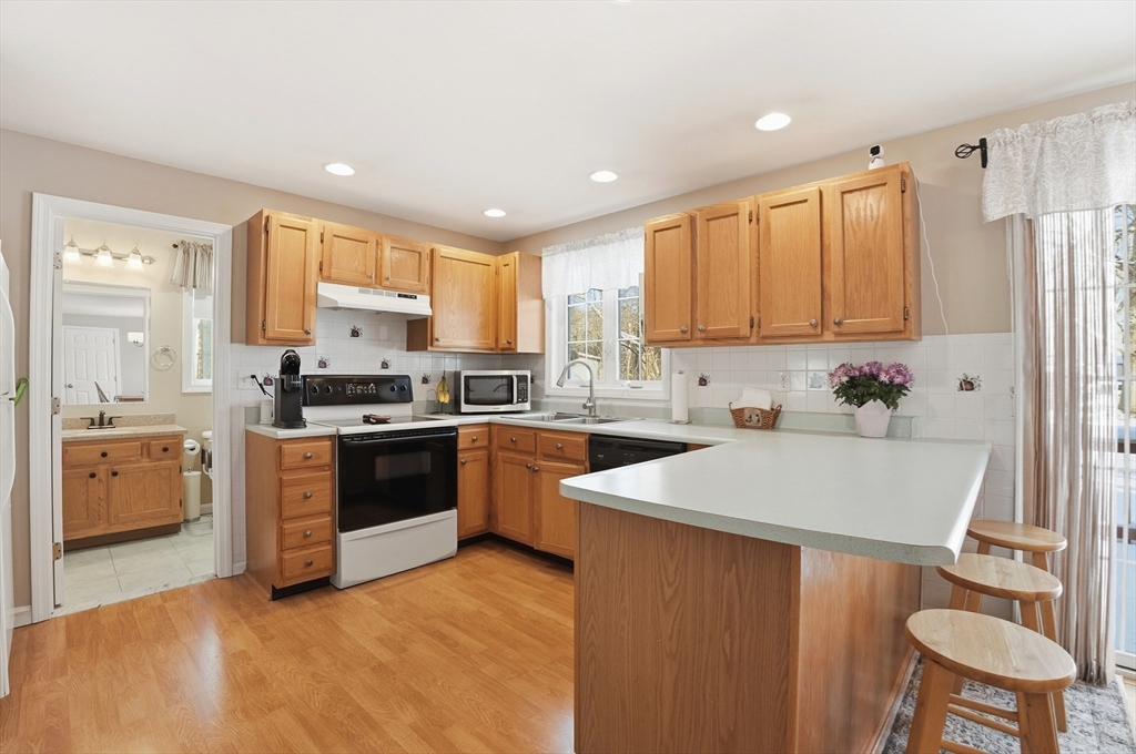 174 Columbus Drive Fall River, MA 02720 - Photo 10 of 33 a kitchen with a sink appliances and cabinets