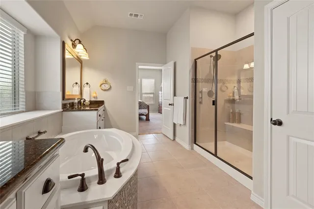 a bathroom with a tub and a sink