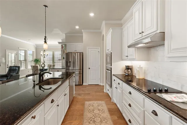 a kitchen with granite countertop lots of counter top space