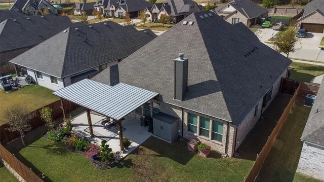 an aerial view of a house having yard