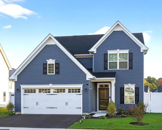 a view of a house with yard and front view of a house