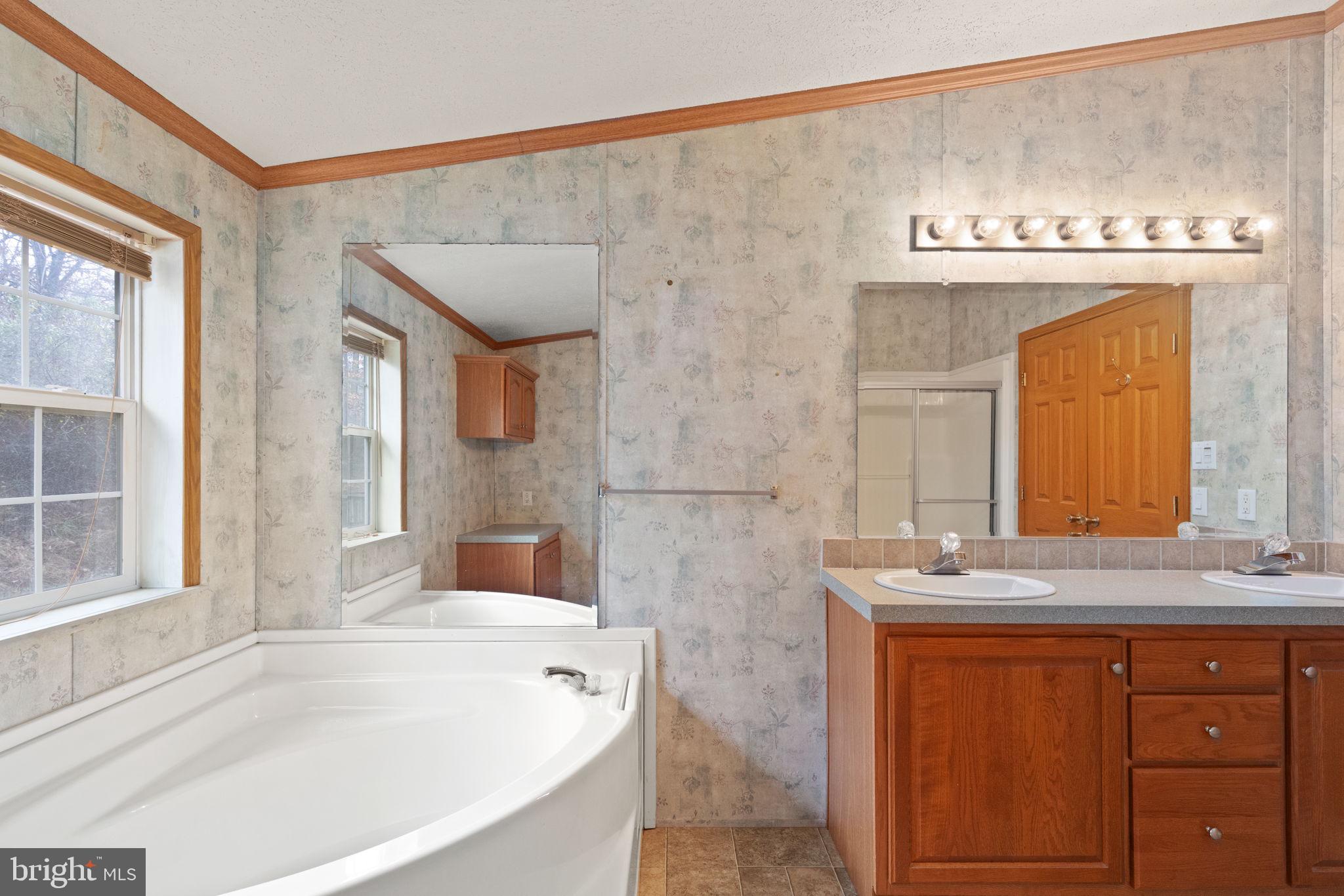 16 High Ridge Road Delta, PA 17314 - Photo 16 of 32 a bath tub sitting next to a bathroom sink