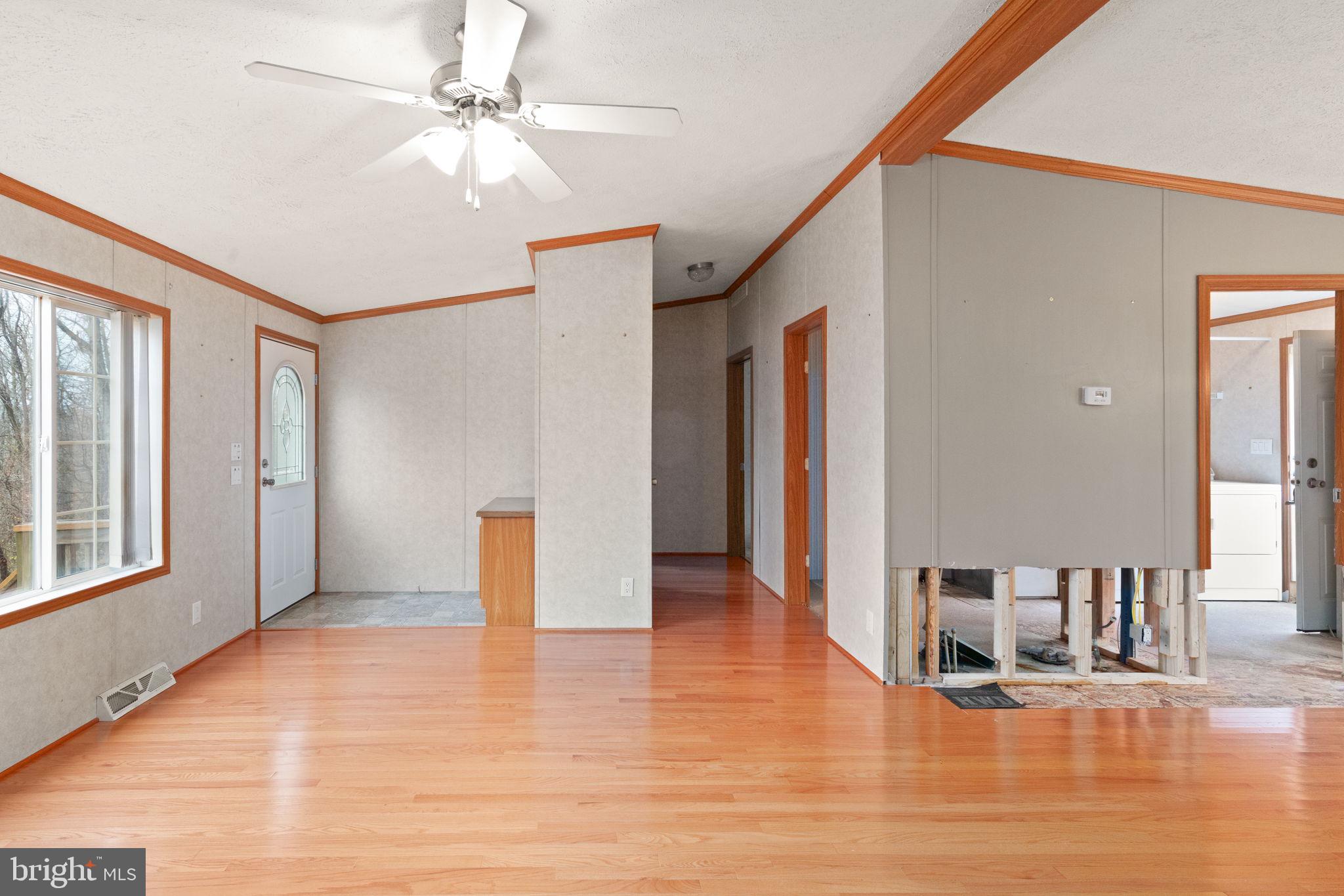 16 High Ridge Road Delta, PA 17314 - Photo 18 of 32 a view of an empty room with window and wooden floor