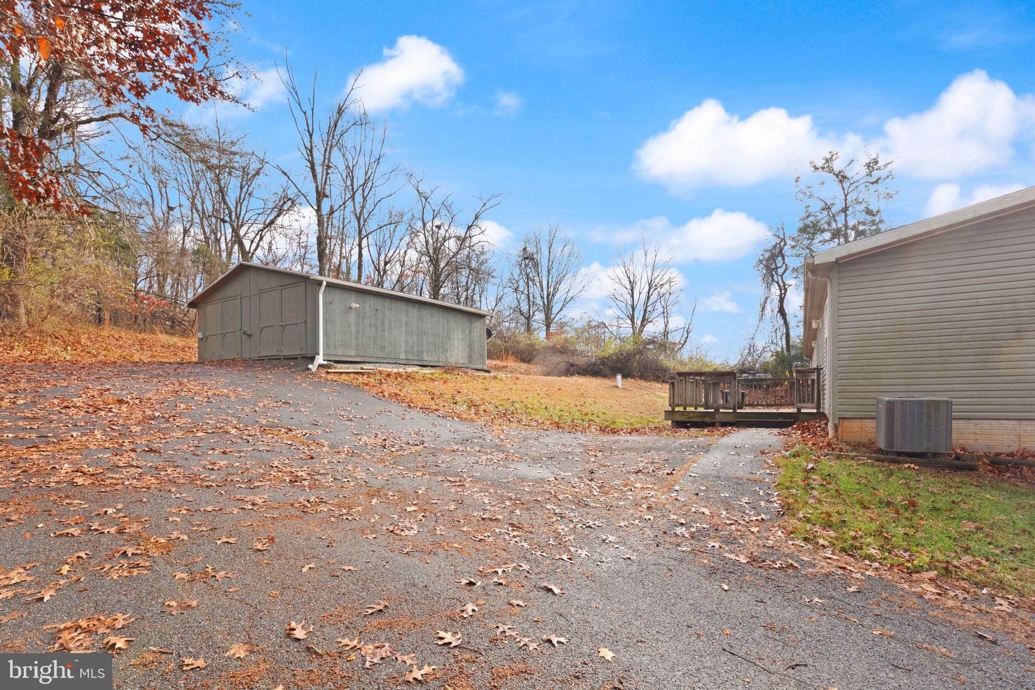 16 High Ridge Road Delta, PA 17314 - Photo 2 of 32 a view of a yard with a snow on the road