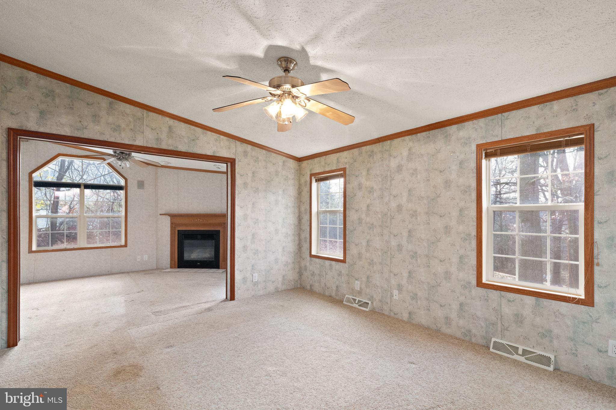 16 High Ridge Road Delta, PA 17314 - Photo 10 of 32 an empty room with windows and fireplace