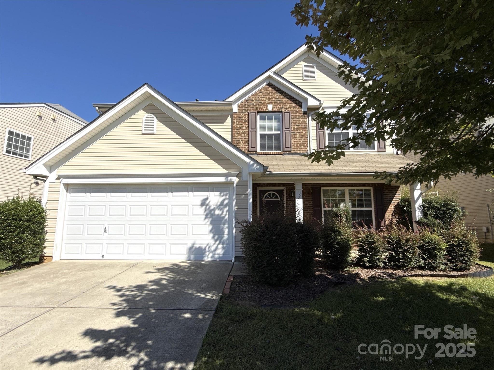 1484 Haverford Road Northwest Concord, NC 28027 - Photo 1 of 33 a front view of a house with garden