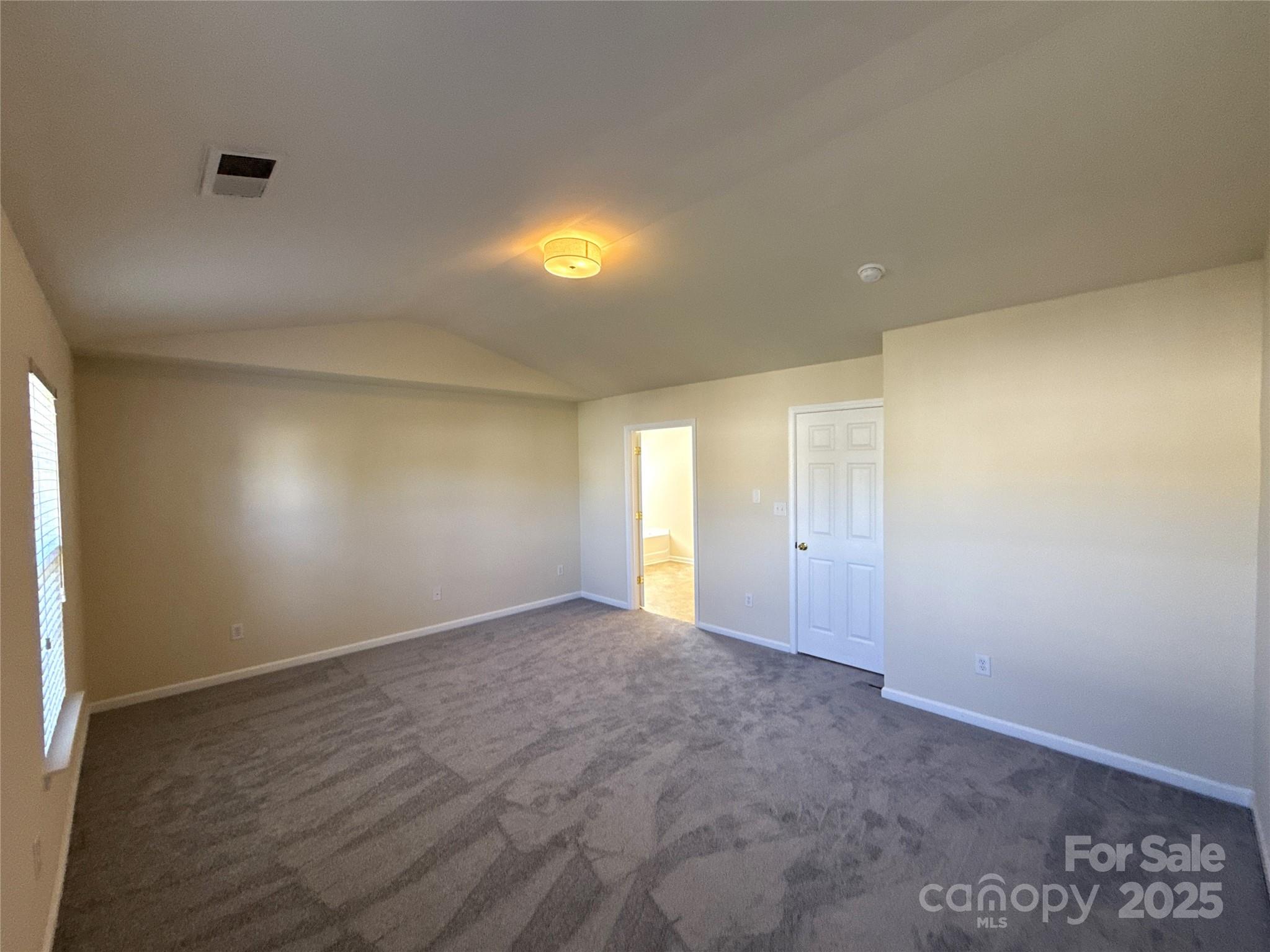 1484 Haverford Road Northwest Concord, NC 28027 - Photo 16 of 33 an empty room with wooden floor and windows