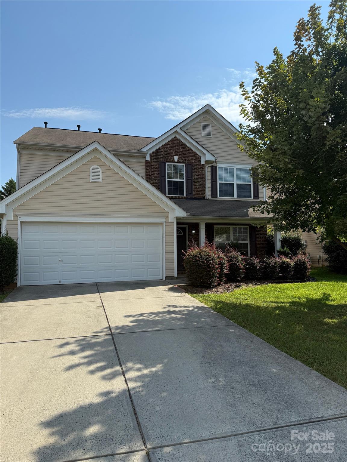 1484 Haverford Road Northwest Concord, NC 28027 - Photo 2 of 33 a front view of a house with a yard and garage