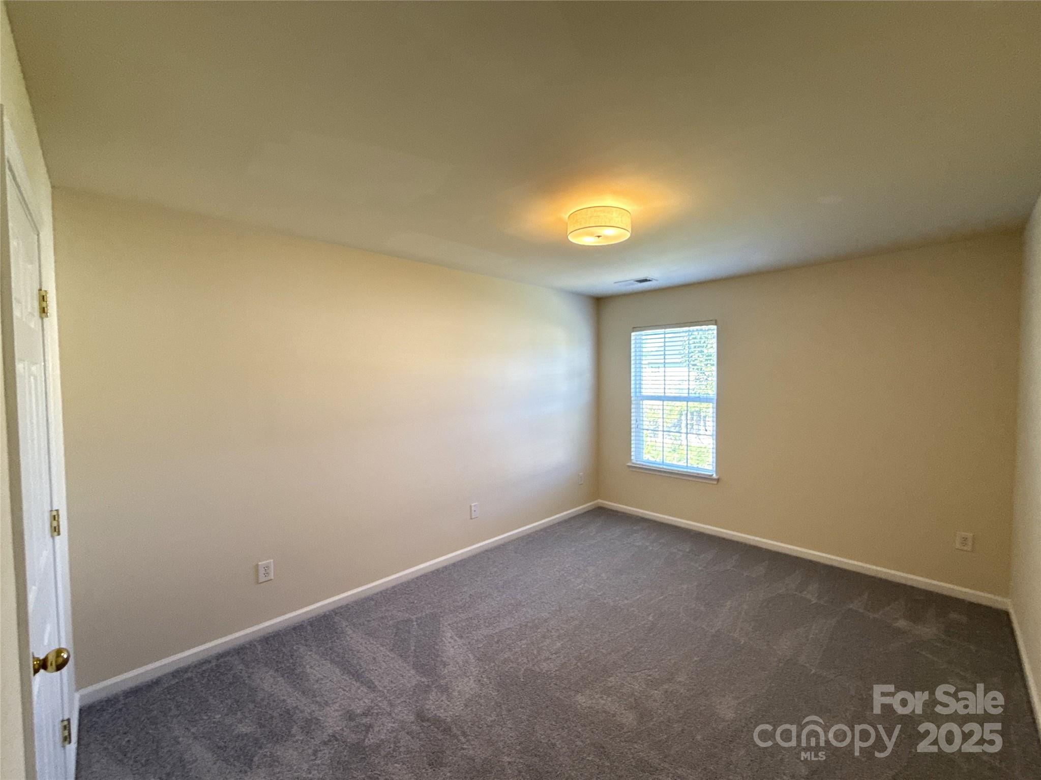 1484 Haverford Road Northwest Concord, NC 28027 - Photo 21 of 33 an empty room with a window