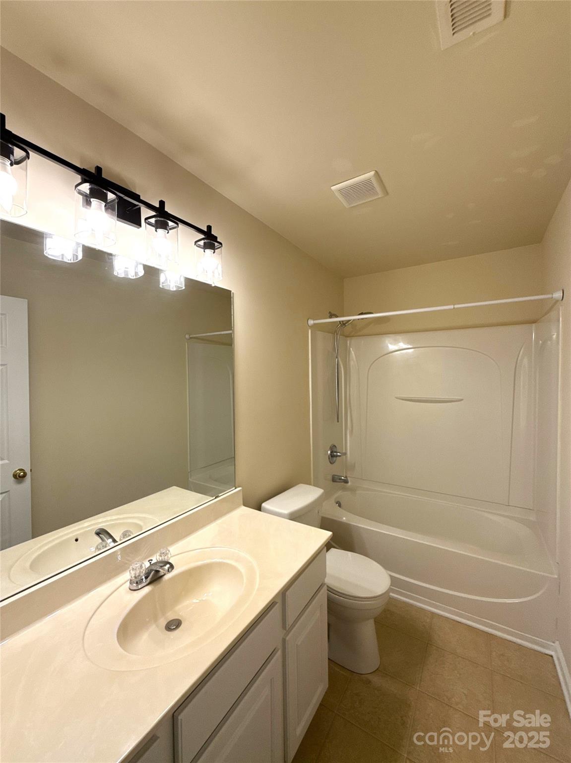 1484 Haverford Road Northwest Concord, NC 28027 - Photo 22 of 33 a bathroom with a sink a toilet and shower