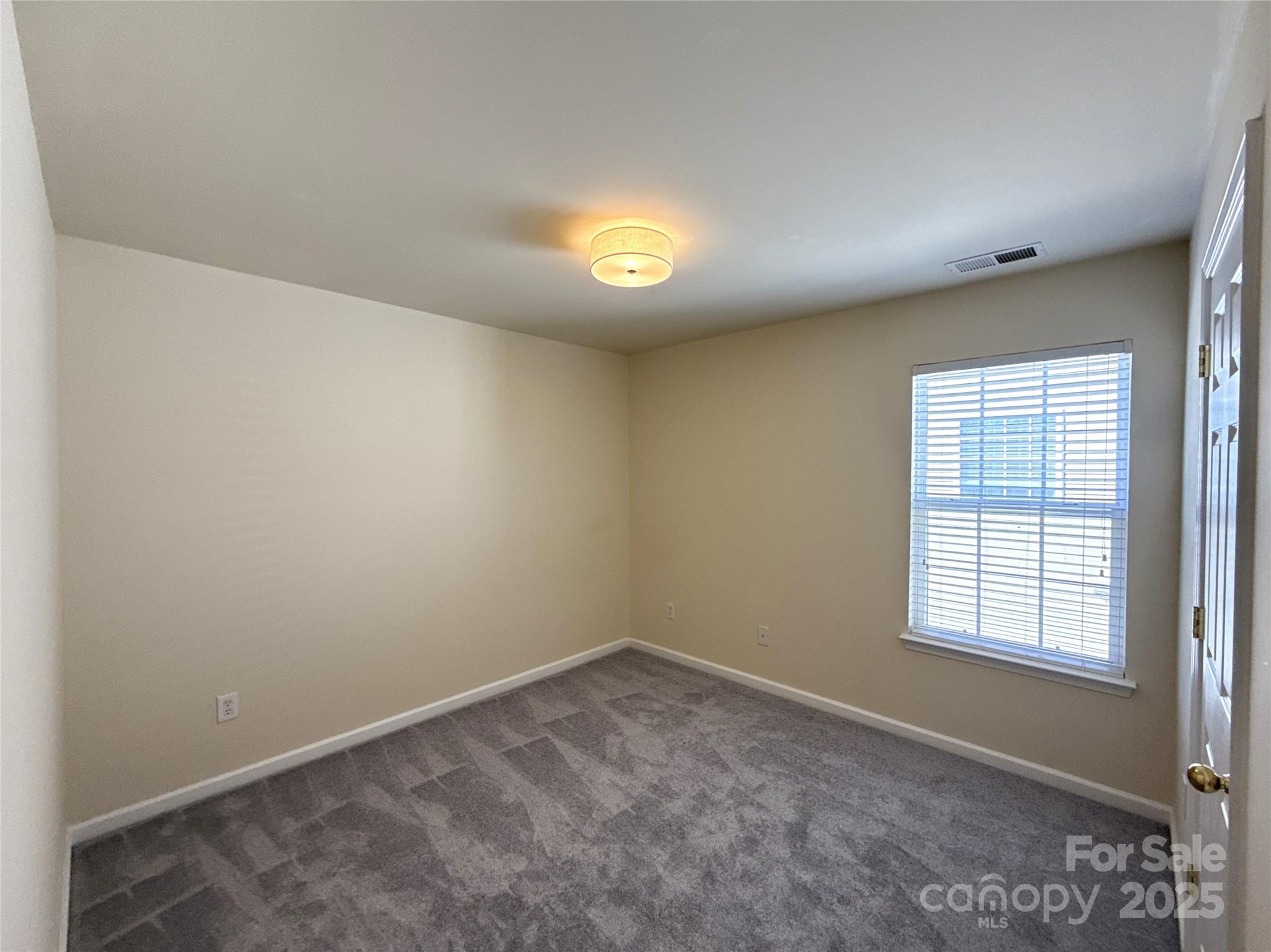 1484 Haverford Road Northwest Concord, NC 28027 - Photo 23 of 33 an empty room with a window