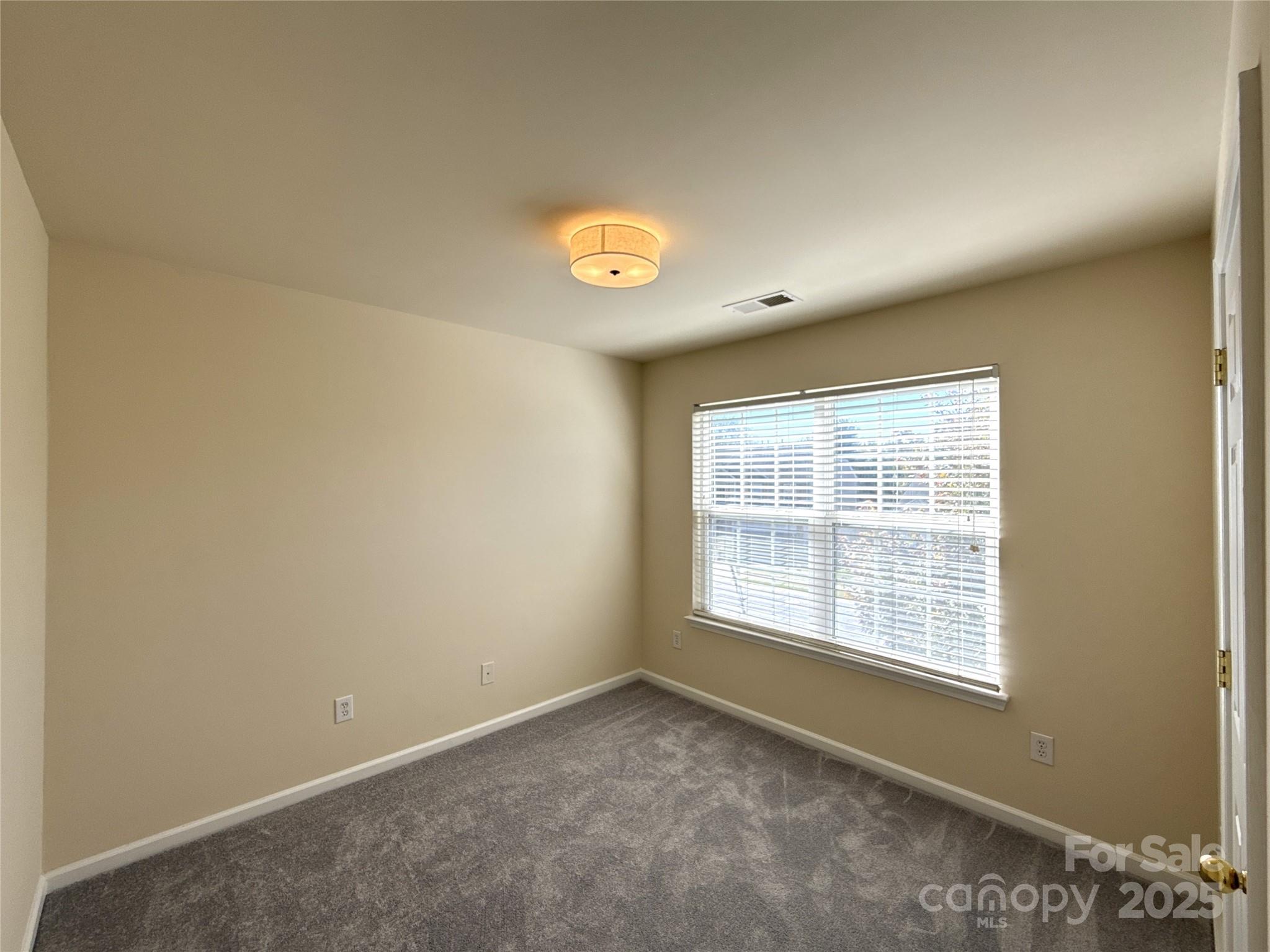 1484 Haverford Road Northwest Concord, NC 28027 - Photo 24 of 33 a view of an empty room with a window