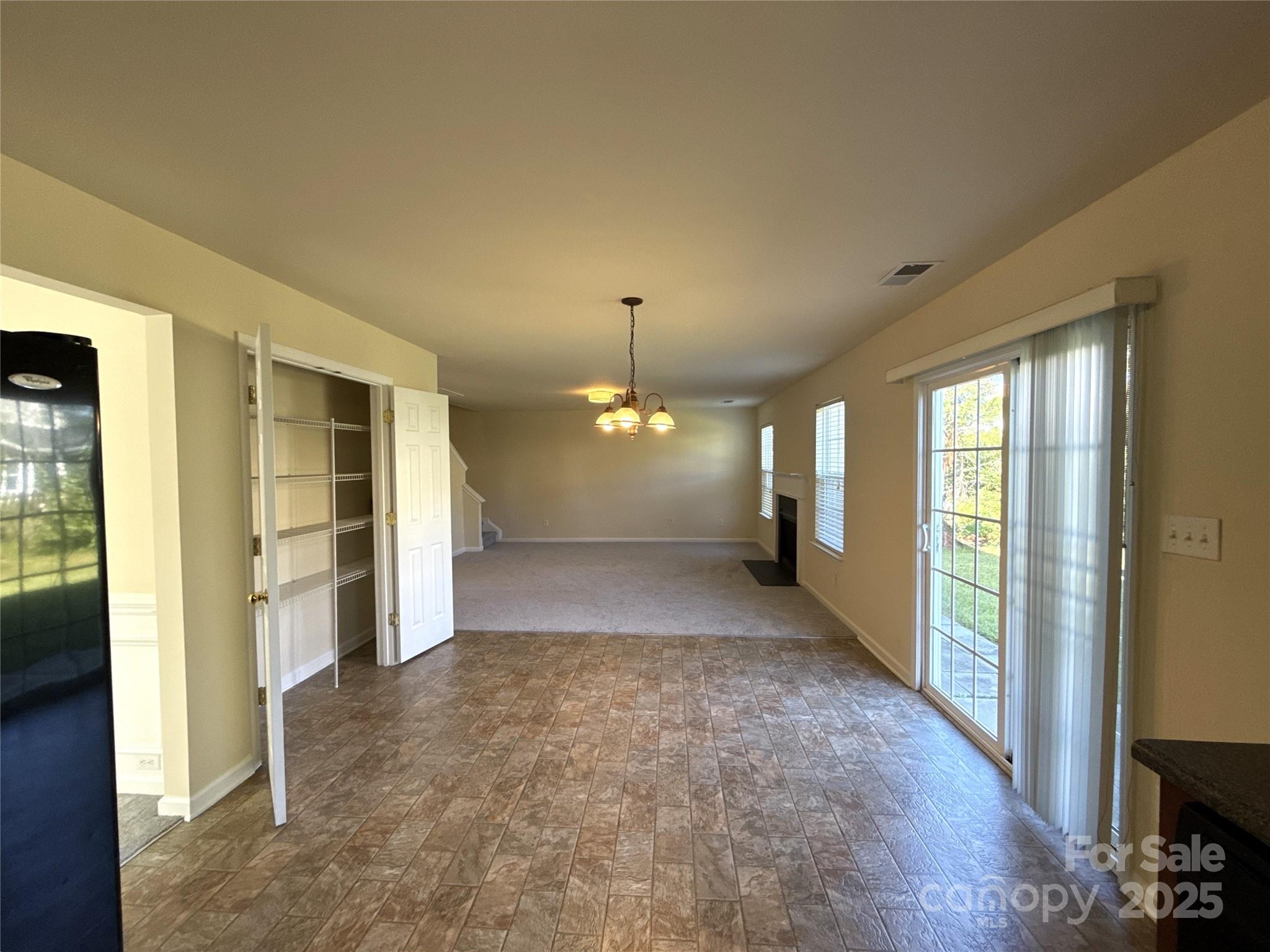 1484 Haverford Road Northwest Concord, NC 28027 - Photo 10 of 33 a view of a room with a fireplace and windows