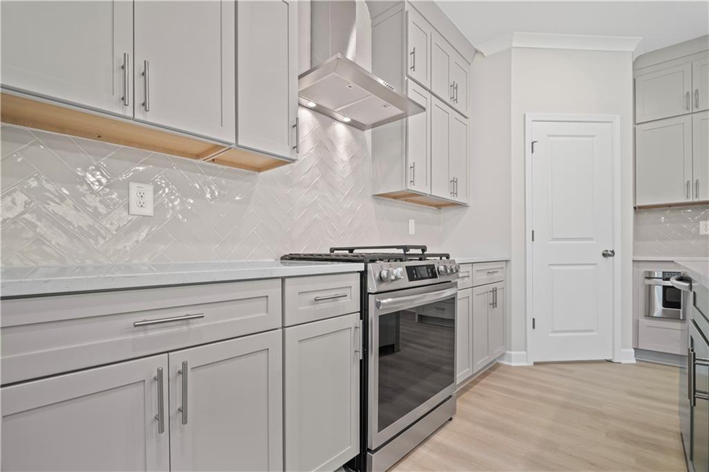 203 Retreat Lane Canton, GA 30114 - Photo 11 of 47 a kitchen with cabinets and stainless steel appliances