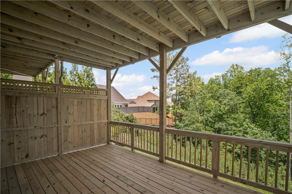 203 Retreat Lane Canton, GA 30114 - Photo 14 of 47 a view of a balcony with wooden floor