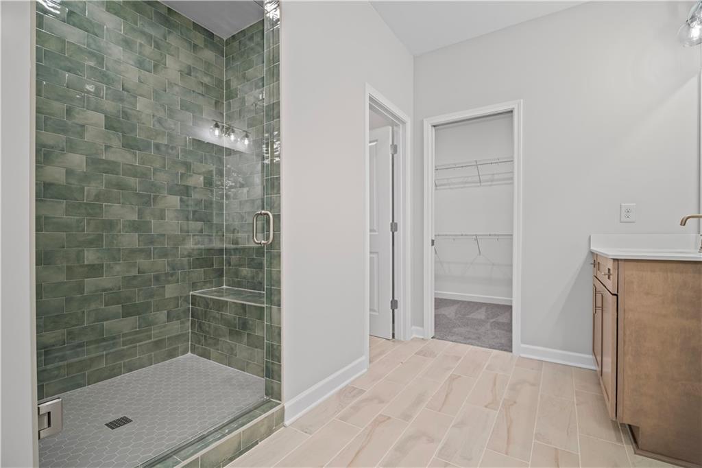 203 Retreat Lane Canton, GA 30114 - Photo 21 of 47 a bathroom with a shower