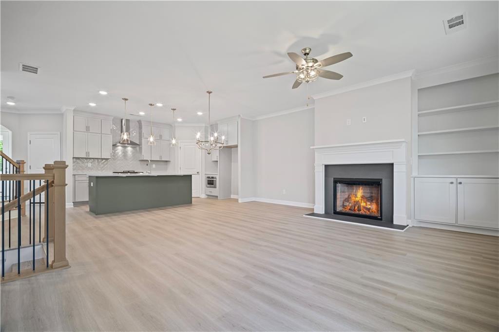 203 Retreat Lane Canton, GA 30114 - Photo 6 of 47 a view of a kitchen with a sink and a fireplace