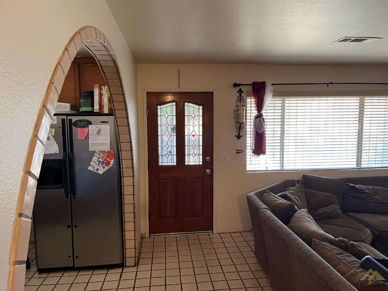 Undisclosed Address Delano, CA 93215 - Photo 2 of 9 a living room with furniture