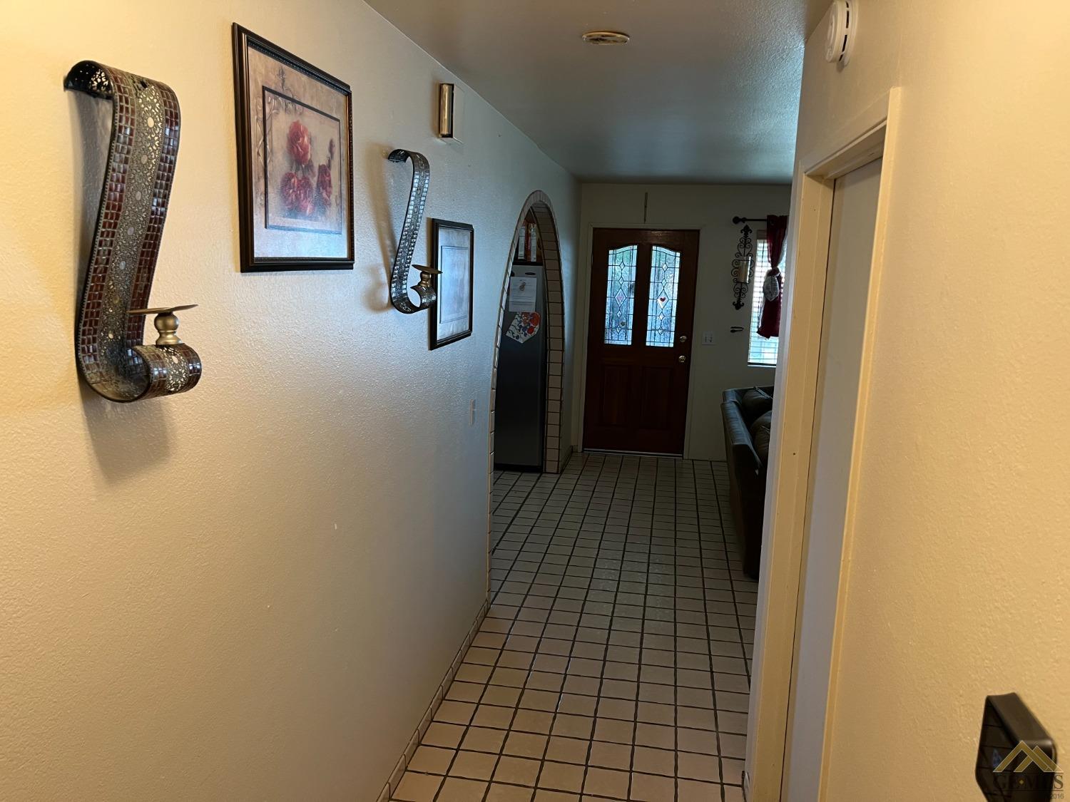 Undisclosed Address Delano, CA 93215 - Photo 4 of 9 a view of a hallway with windows