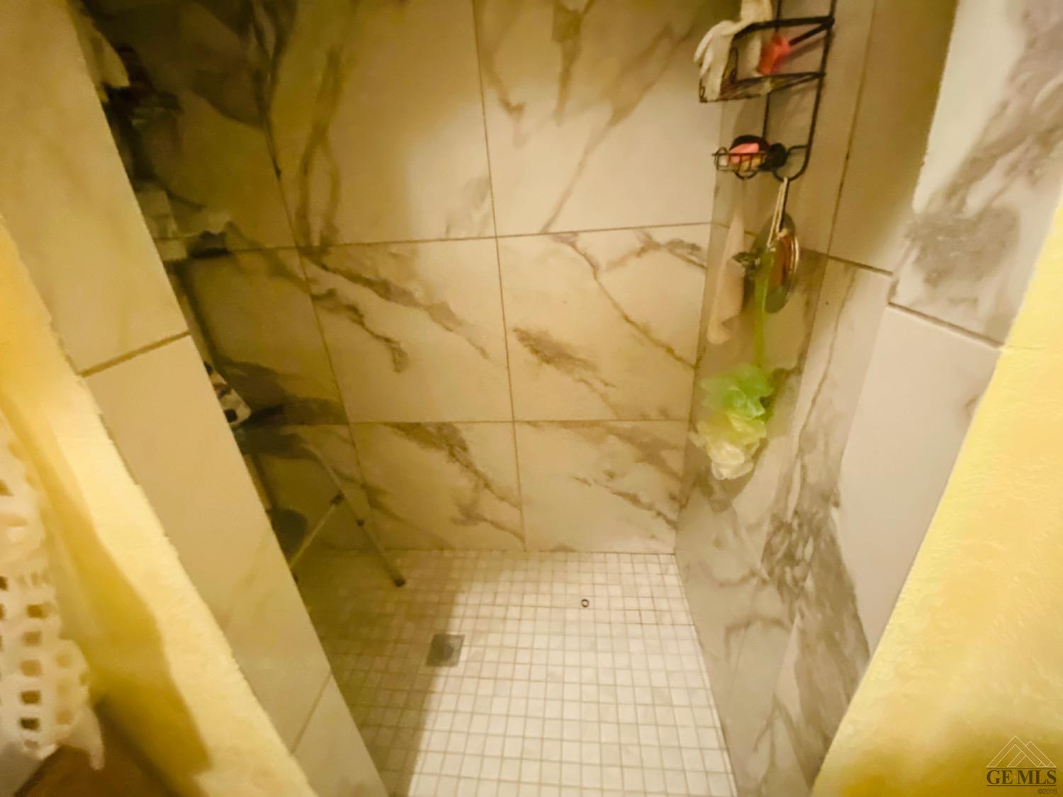 Undisclosed Address Delano, CA 93215 - Photo 7 of 9 a bathroom with a shower