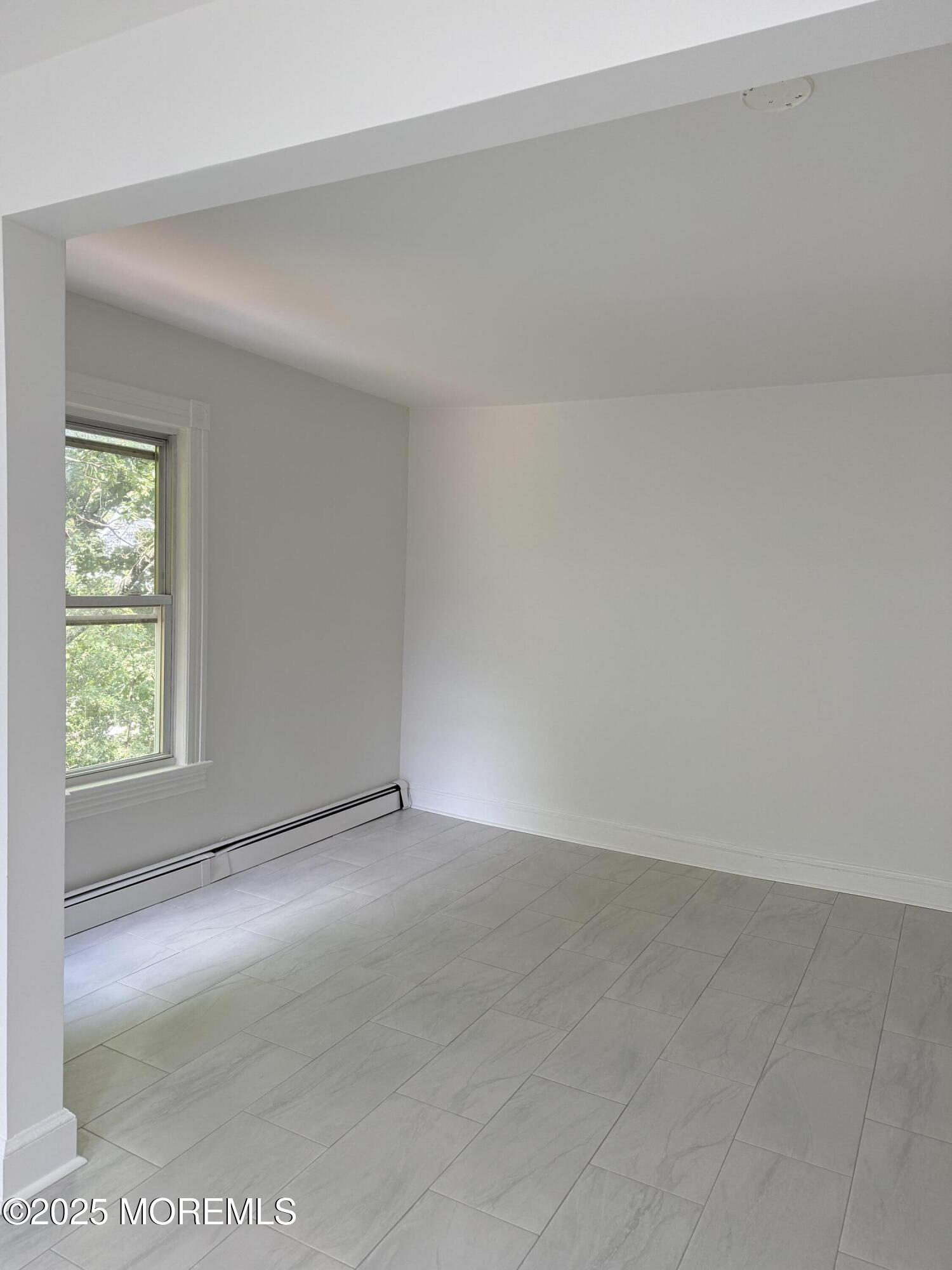140 Franklin Avenue, Unit 3 Long Branch, NJ 07740 - Photo 6 of 14 an empty room with windows
