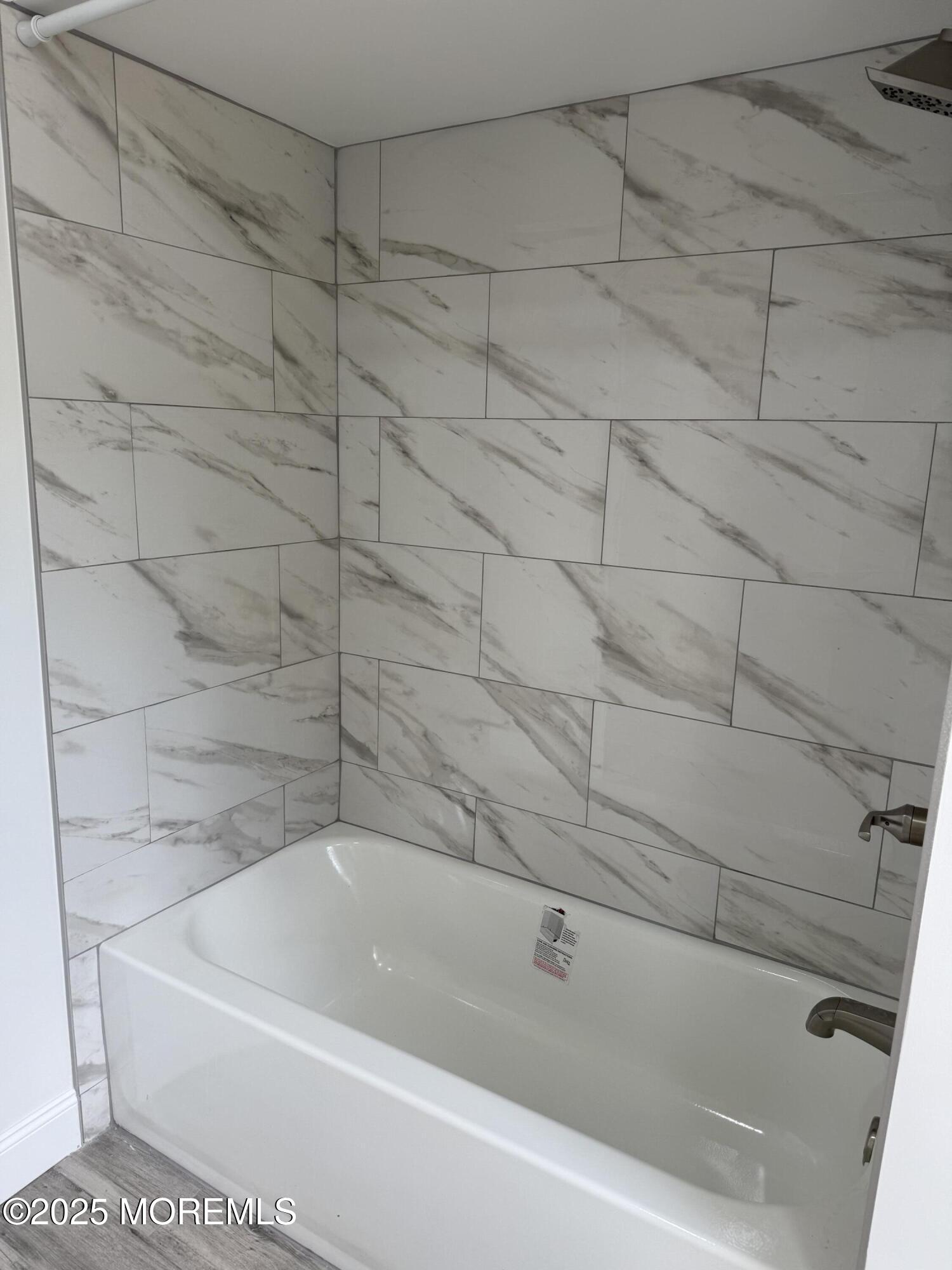 140 Franklin Avenue, Unit 3 Long Branch, NJ 07740 - Photo 8 of 14 a bathroom with a bathtub