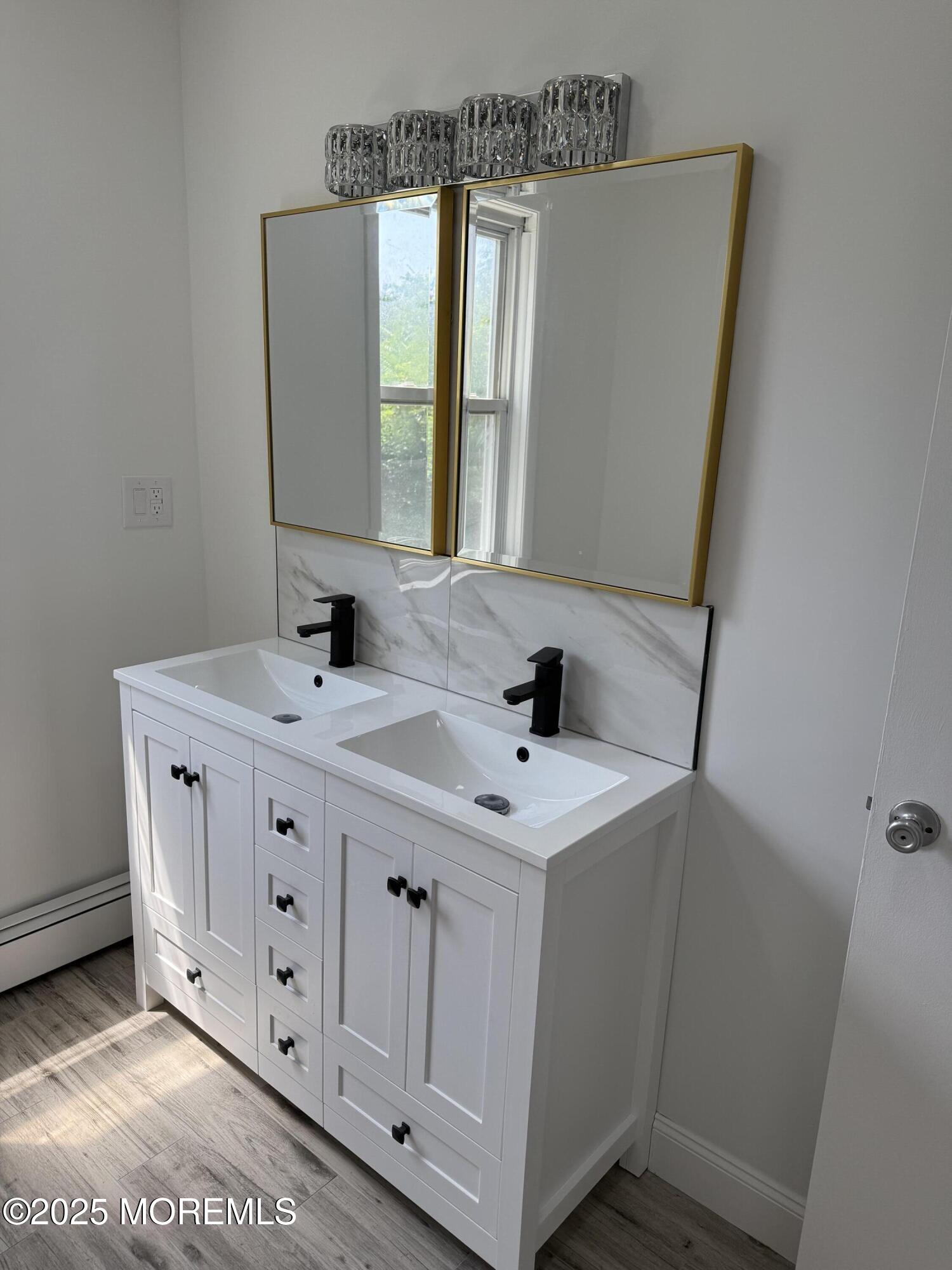 140 Franklin Avenue, Unit 3 Long Branch, NJ 07740 - Photo 10 of 14 a bathroom with a sink and a mirror