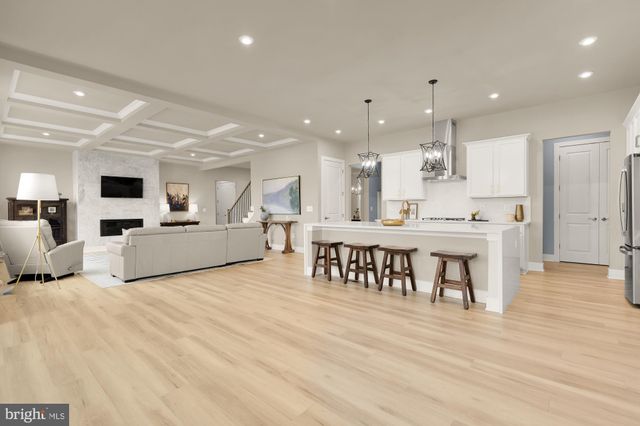 a large kitchen with stainless steel appliances lots of counter space and a sink