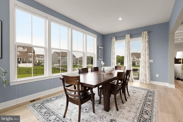 a view of a patio with couches chairs and potted plants