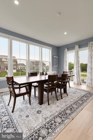 a bedroom with a bed dresser and a window