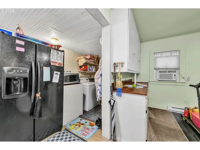 a kitchen with stainless steel appliances a refrigerator and a stove
