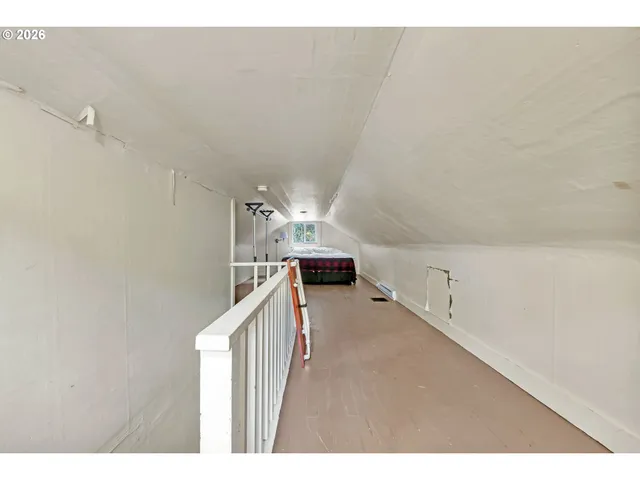 a view of a hallway with stairs