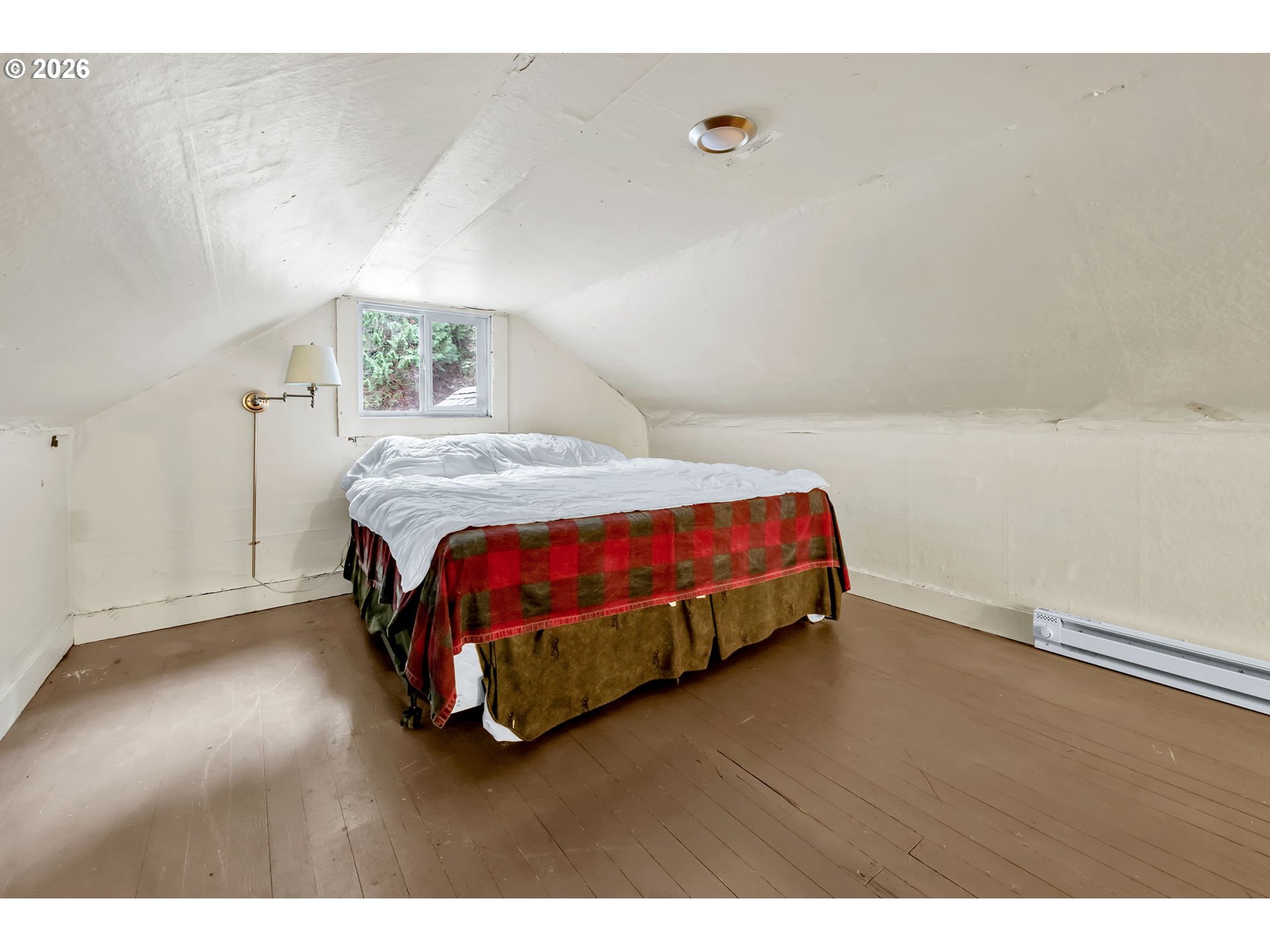 47054 Westfir-Oakridge Road Westfir, OR 97492 - Photo 19 of 28 a bedroom with a bed and a window