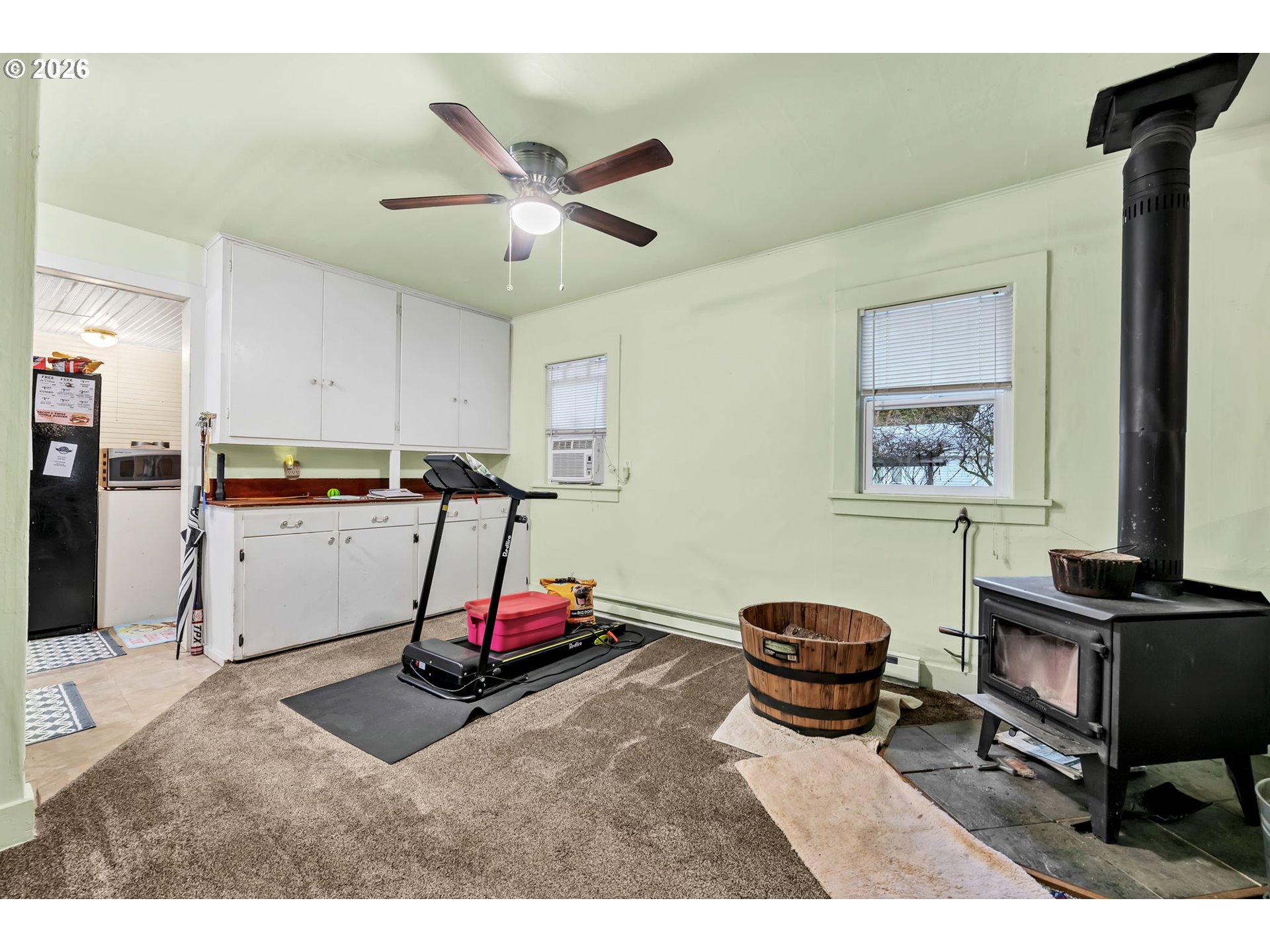 47054 Westfir-Oakridge Road Westfir, OR 97492 - Photo 8 of 28 a living room with kitchen and gym equipment