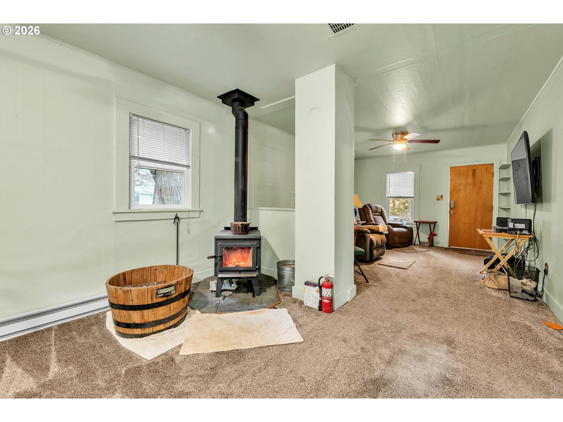 47054 Westfir-Oakridge Road Westfir, OR 97492 - Photo 9 of 28 a living room with furniture a flat screen tv and a window