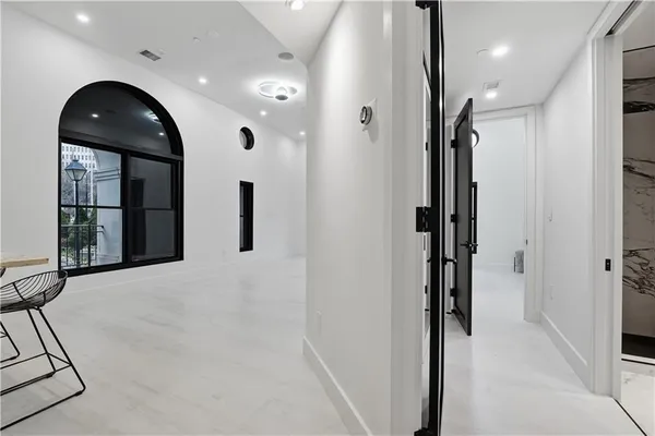 a view of a hallway with washer and dryer