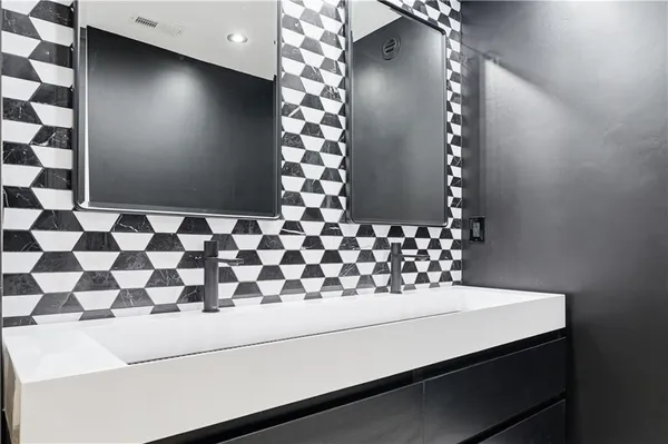 a bathroom with a bathtub and shower