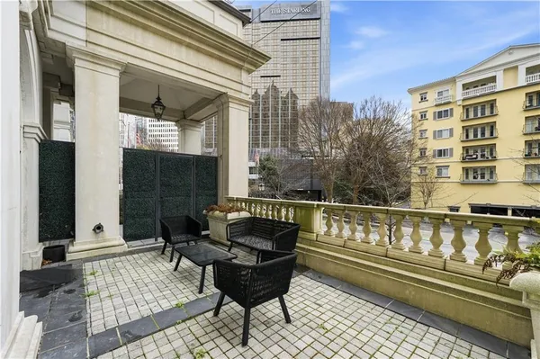 a view of two chairs in the balcony