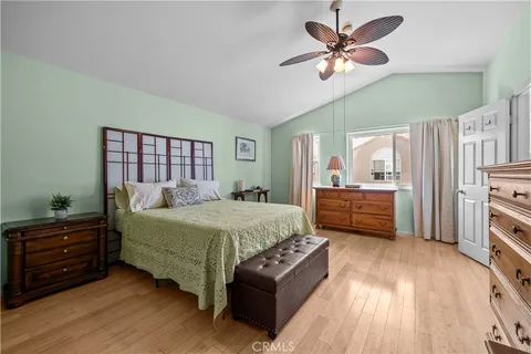 a bedroom with a bed dresser and a window