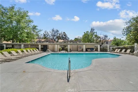 a view of a swimming pool with a patio