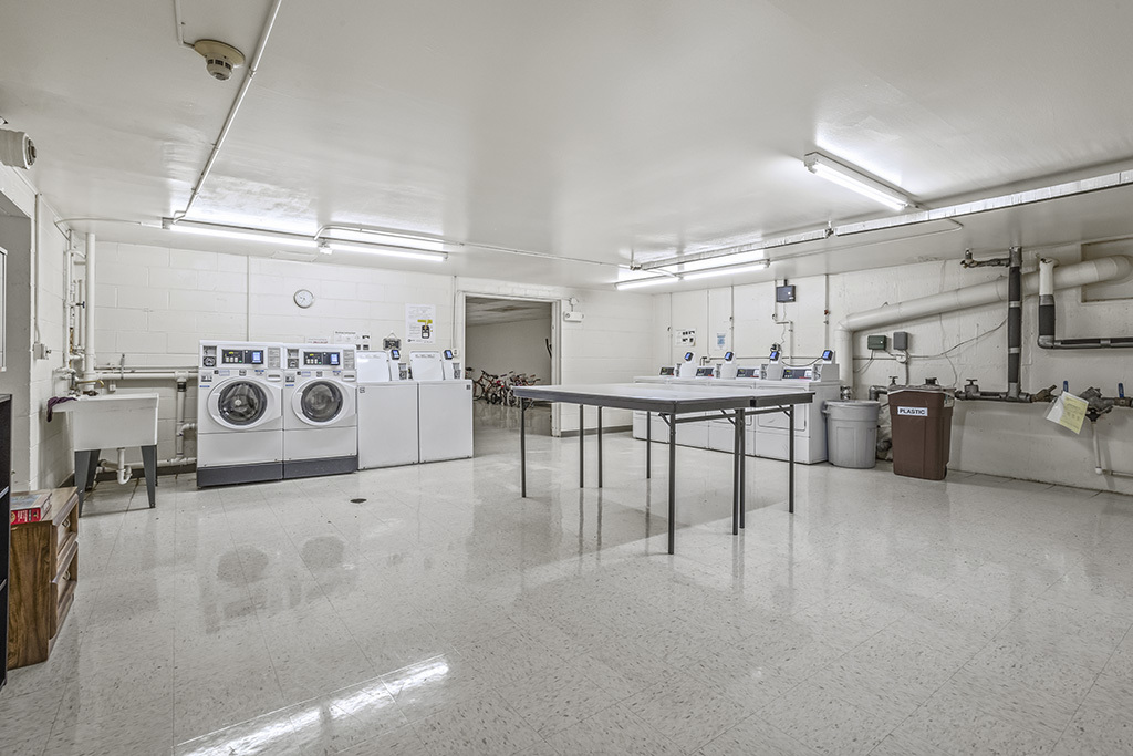 3913 Saratoga Avenue, Unit G306 Downers Grove, IL 60515 - Photo 18 of 18 a view of a kitchen with furniture and a clock