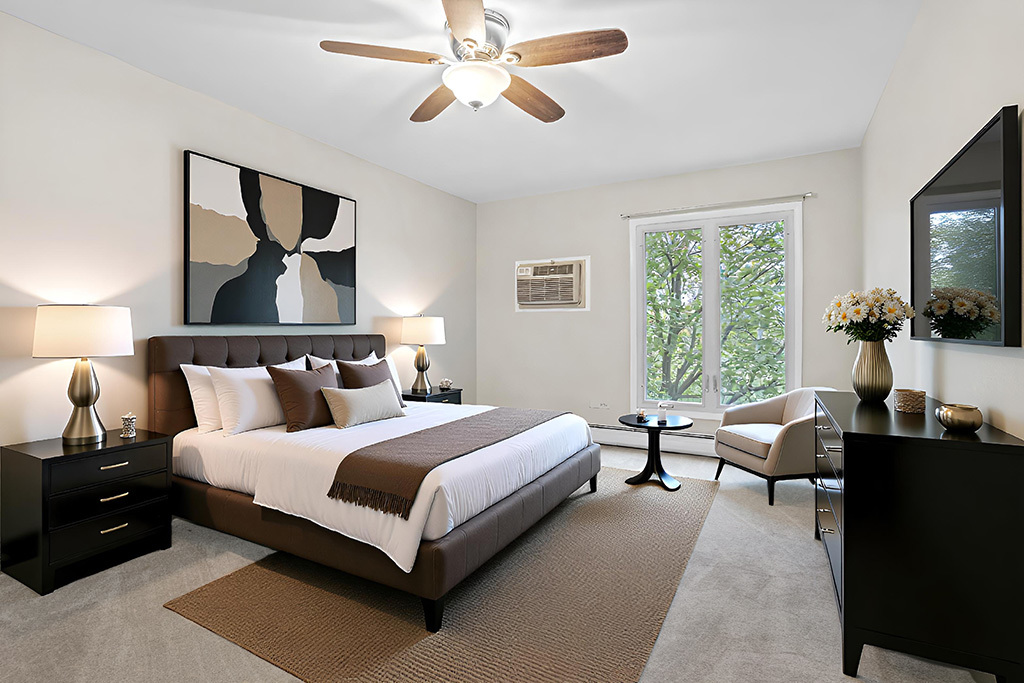 3913 Saratoga Avenue, Unit G306 Downers Grove, IL 60515 - Photo 9 of 18 a bedroom with bed and a flat tv screen on dresser