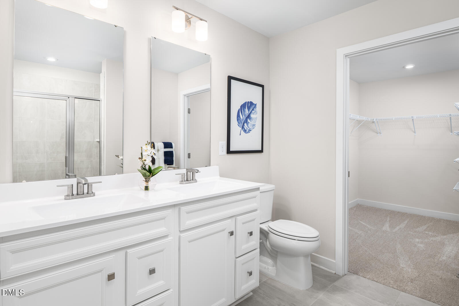648 Pasture Ridge Road Raleigh, NC 27603 - Photo 15 of 22 a bathroom with a toilet a sink and mirror