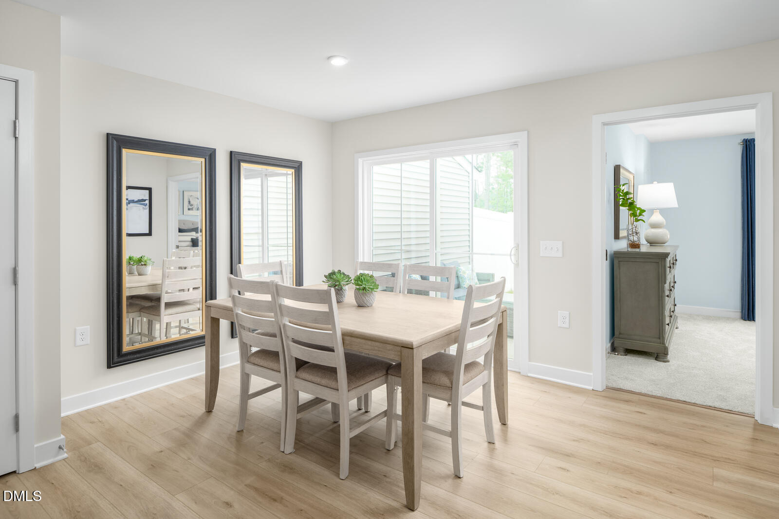 648 Pasture Ridge Road Raleigh, NC 27603 - Photo 7 of 22 a view of a dining room with furniture and wooden floor
