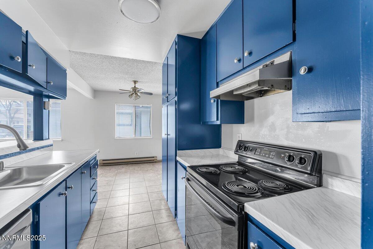 765 Jamaica Avenue, Unit 2 Reno, NV 89502 - Photo 11 of 23 a kitchen with a stove and a sink