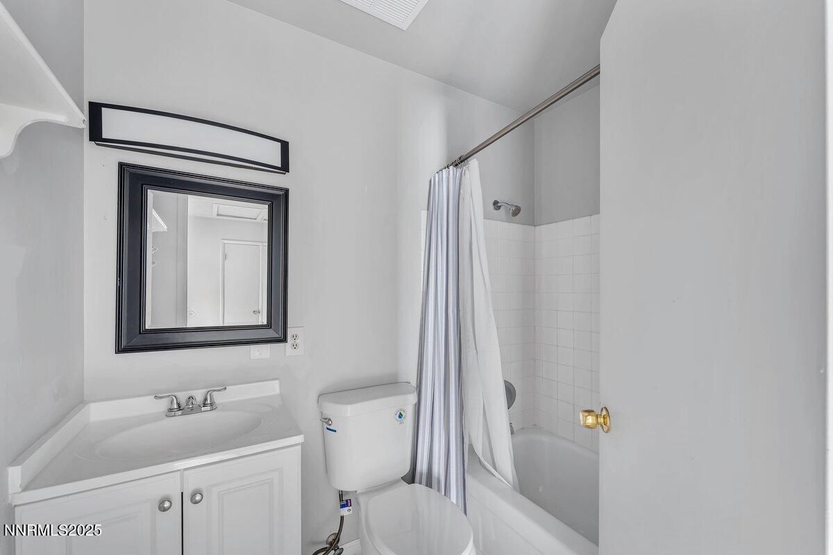 765 Jamaica Avenue, Unit 2 Reno, NV 89502 - Photo 16 of 23 a bathroom with a sink toilet and shower