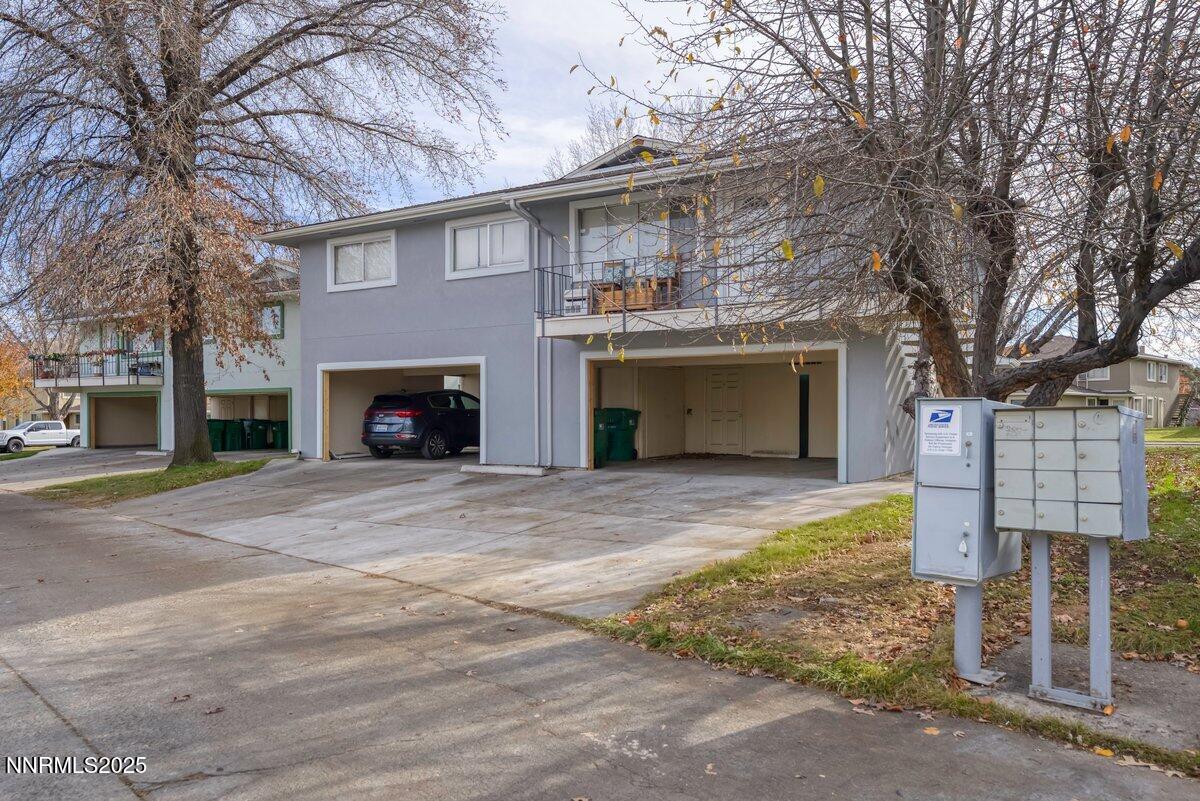765 Jamaica Avenue, Unit 2 Reno, NV 89502 - Photo 19 of 23 a front view of a house with a yard and garage